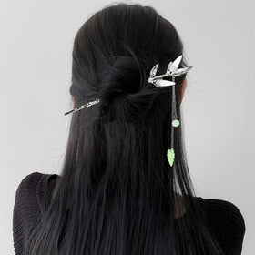 Arvintas hair stick securing a bun illustrating reliable hold and style