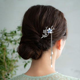 Arvintas hair stick beside ruler showing length ideal for medium to thick hair