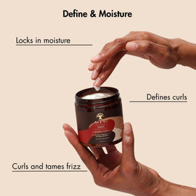 As I Am jar in hand demonstrating 8 ounce scale for travel-friendly use