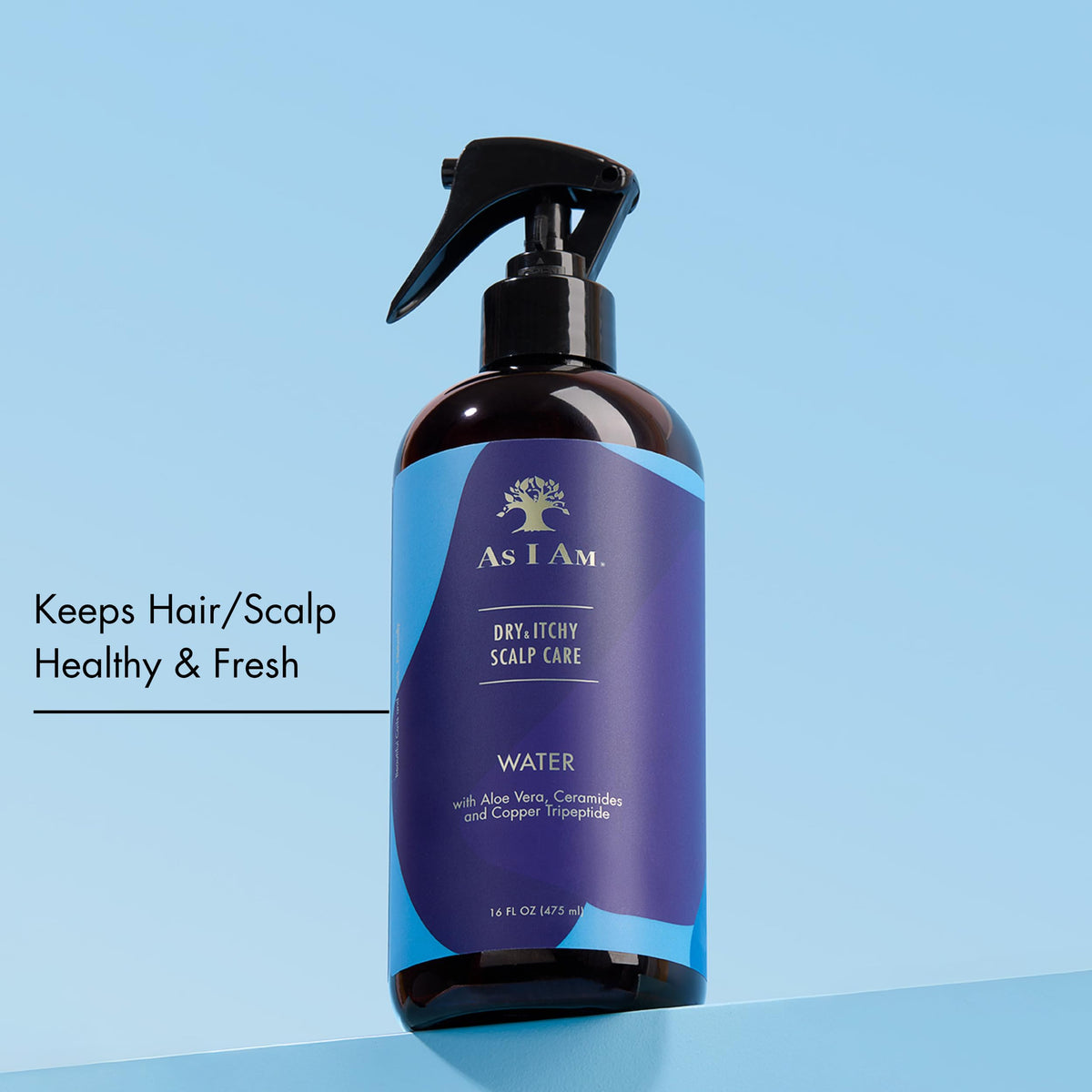 As I Am being sprayed on parted scalp illustrating targeted application benefit