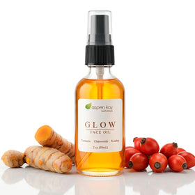 Aspen Kay Naturals front bottle view showing natural face oil packaging and glow