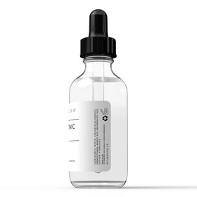 Asterwood 2 fl oz bottle next to common objects for scale benefit: generous size