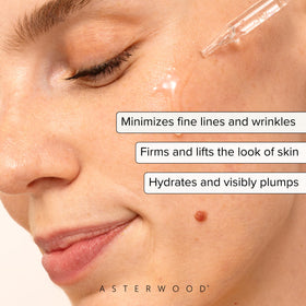 Asterwood dropper dispensing clear serum for precise, hygienic application