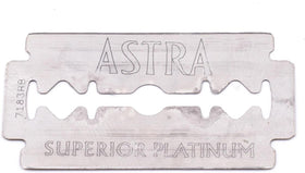 ASTRA blade loaded in safety razor demonstrating secure fit and efficient shave