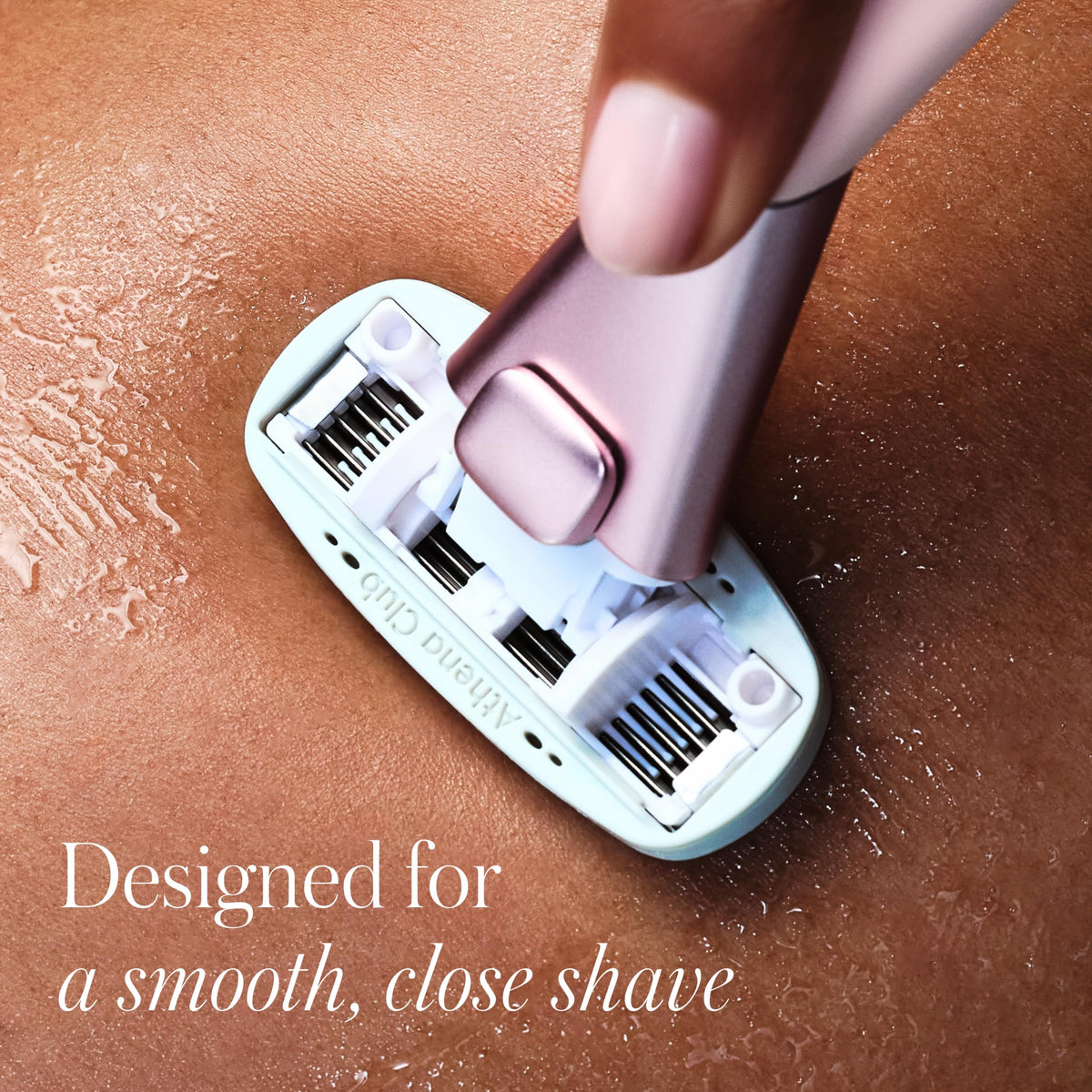 Athena Club razor in hand shaving leg demonstrating secure non-slip grip