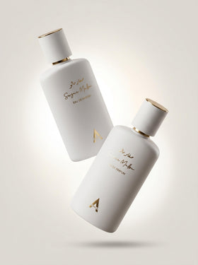 Atralia perfume beside marshmallow and strawberries showing sweet ingredients