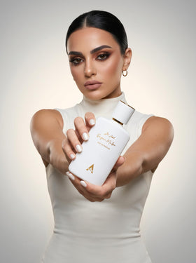 Atralia bottle next to everyday items showing 100ml size and portability