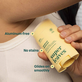 ATTITUDE held in hand for scale, illustrates compact travel-friendly size