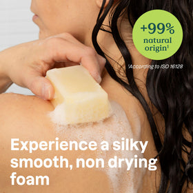 ATTITUDE soap bar in hand to show size and gentle cleansing benefit