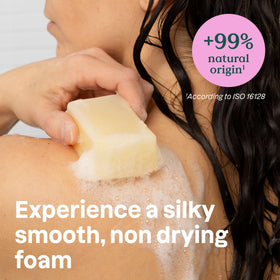 ATTITUDE soap held in hand to show 4 oz scale for travel convenience