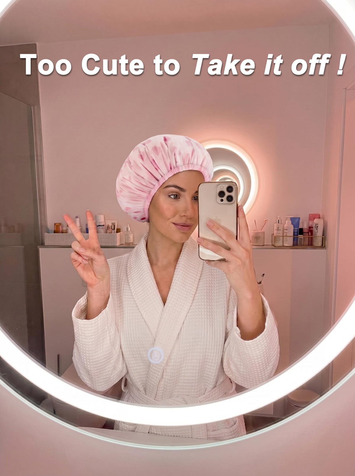 Auban shower cap shown in hand to illustrate large fit for thick or long hair