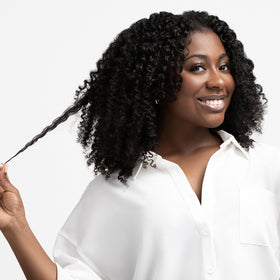 Aunt Jackie's after use curly hair with reduced frizz and enhanced shine