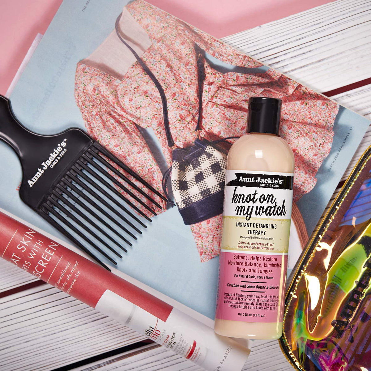 Applying Aunt Jackie's on damp curly hair to demonstrate easier combing and reduced pulling