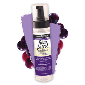 Applying Aunt Jackie's mousse to curly hair to demonstrate definition and frizz control