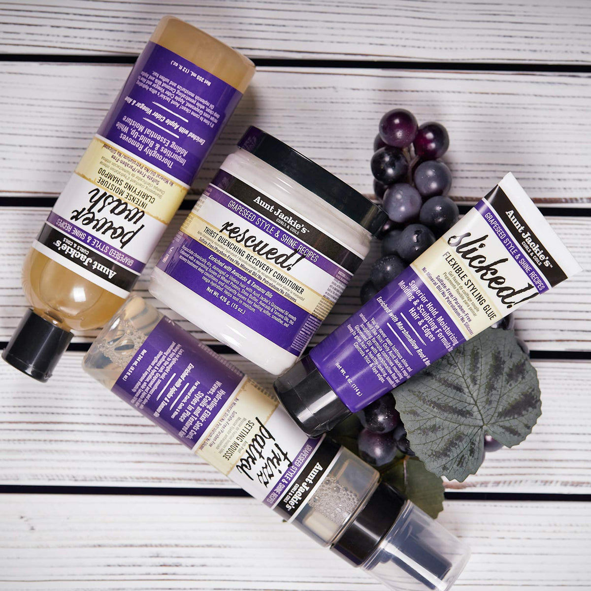 Lifestyle bathroom shelf with Aunt Jackie's mousse placed among daily hair care items