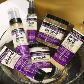 Lifestyle shot of curly hair styled with Aunt Jackie's for natural glossy definition