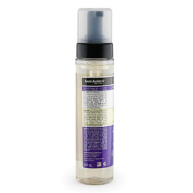 Mousse dispensed on hand from Aunt Jackie's bottle highlighting manageable, non-sticky foam