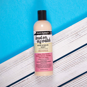 Aunt Jackie's bottle on bathroom shelf conveying convenient everyday use and accessibility