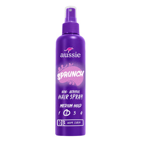 Aussie hairspray front packaging showing three bottles and product branding benefit strong hold