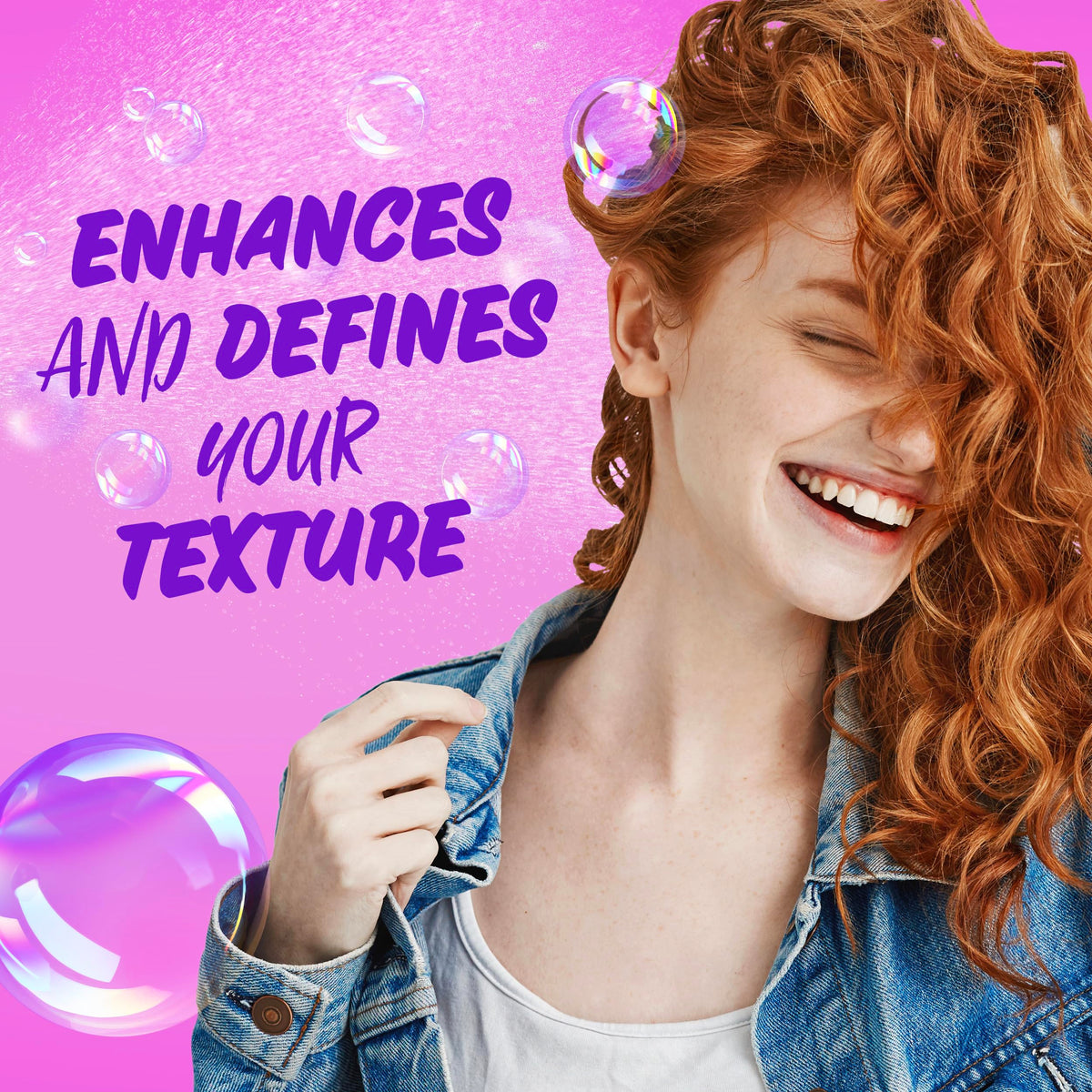 Aussie hairspray misting onto styled curls demonstrating long-lasting definition benefit