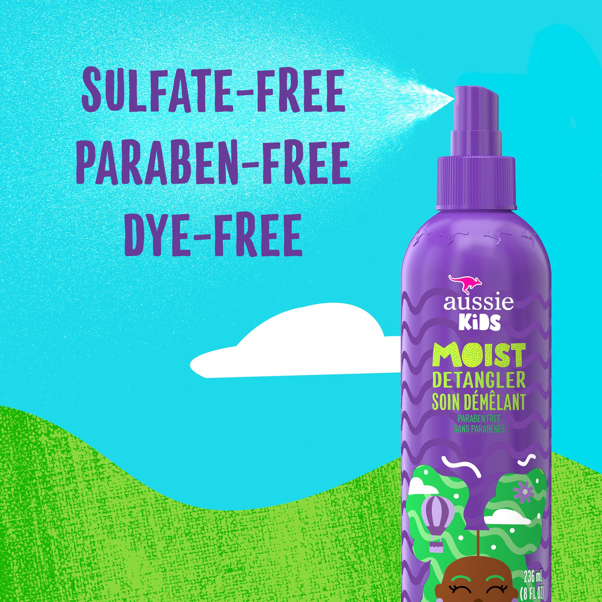 Aussie spray being misted onto child hair for smoother combing and less pulling
