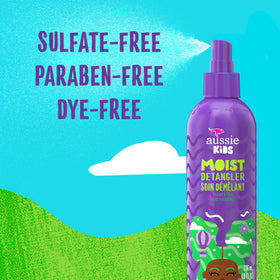 Aussie spray being misted onto child hair for smoother combing and less pulling