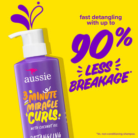 Aussie detangling milk flowing from bottle illustrating easy comb-through benefits