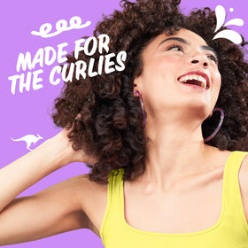 Aussie curl refresher gel being applied to hair demonstrating definition and hold