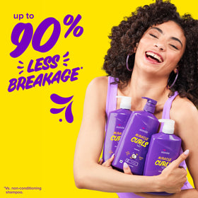 Aussie conditioner poured into hand, illustrating generous slip and detangling benefit
