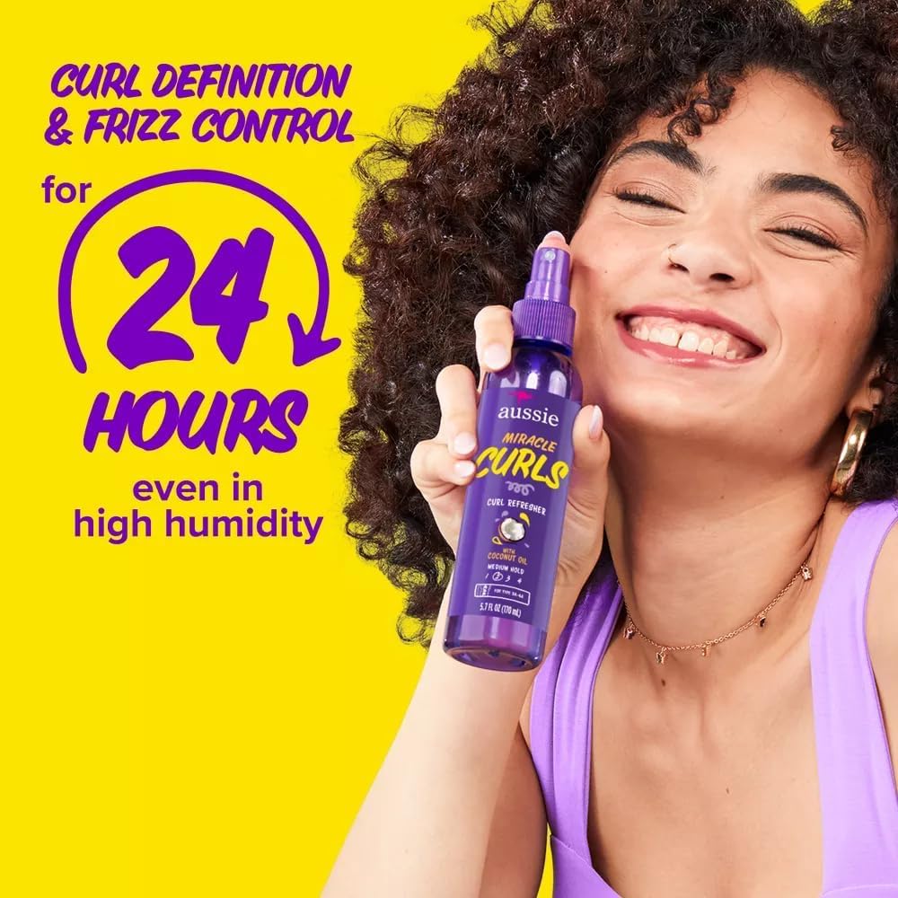 Aussie spray applied to dry curly hair to revive definition and reduce frizz