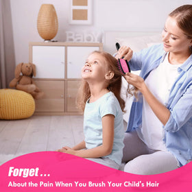Aussumy brush held next to a hand to show compact size and easy portability