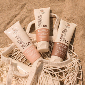 Australian Gold worn outdoors at beach demonstrating water-resistant protection