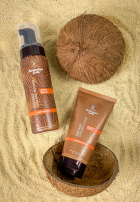 Australian Gold bottle staged in summer setting showing lifestyle appeal and natural glow benefit