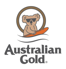 Australian Gold bottle on beach towel evoking tropical fragrance and bronzing result