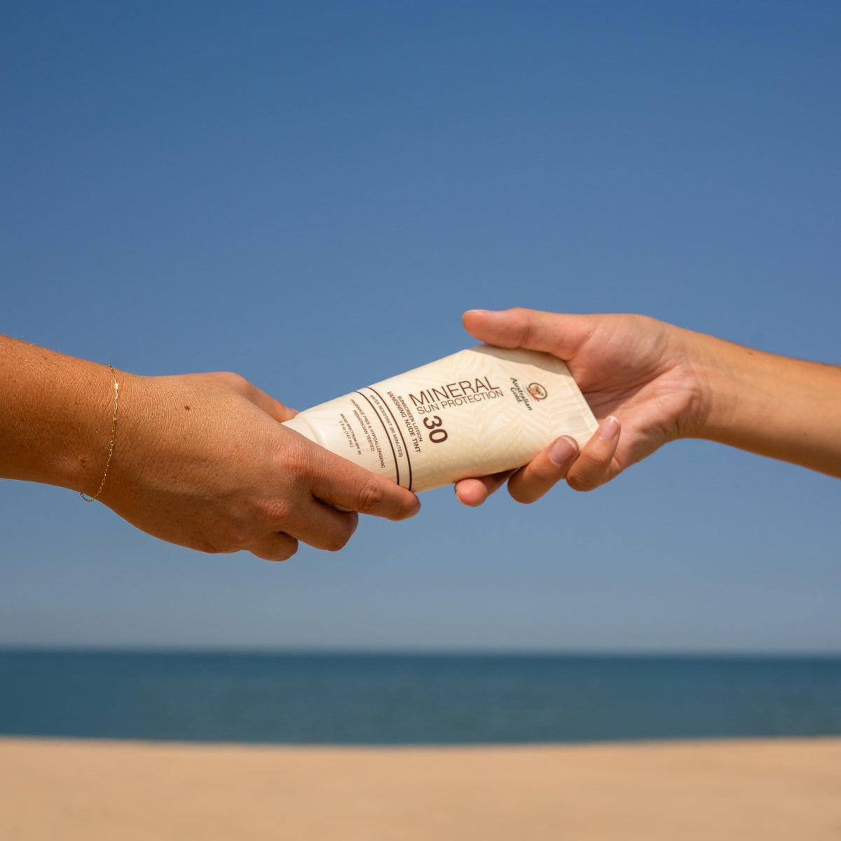 Australian Gold used by family outdoors illustrating broad-spectrum protection