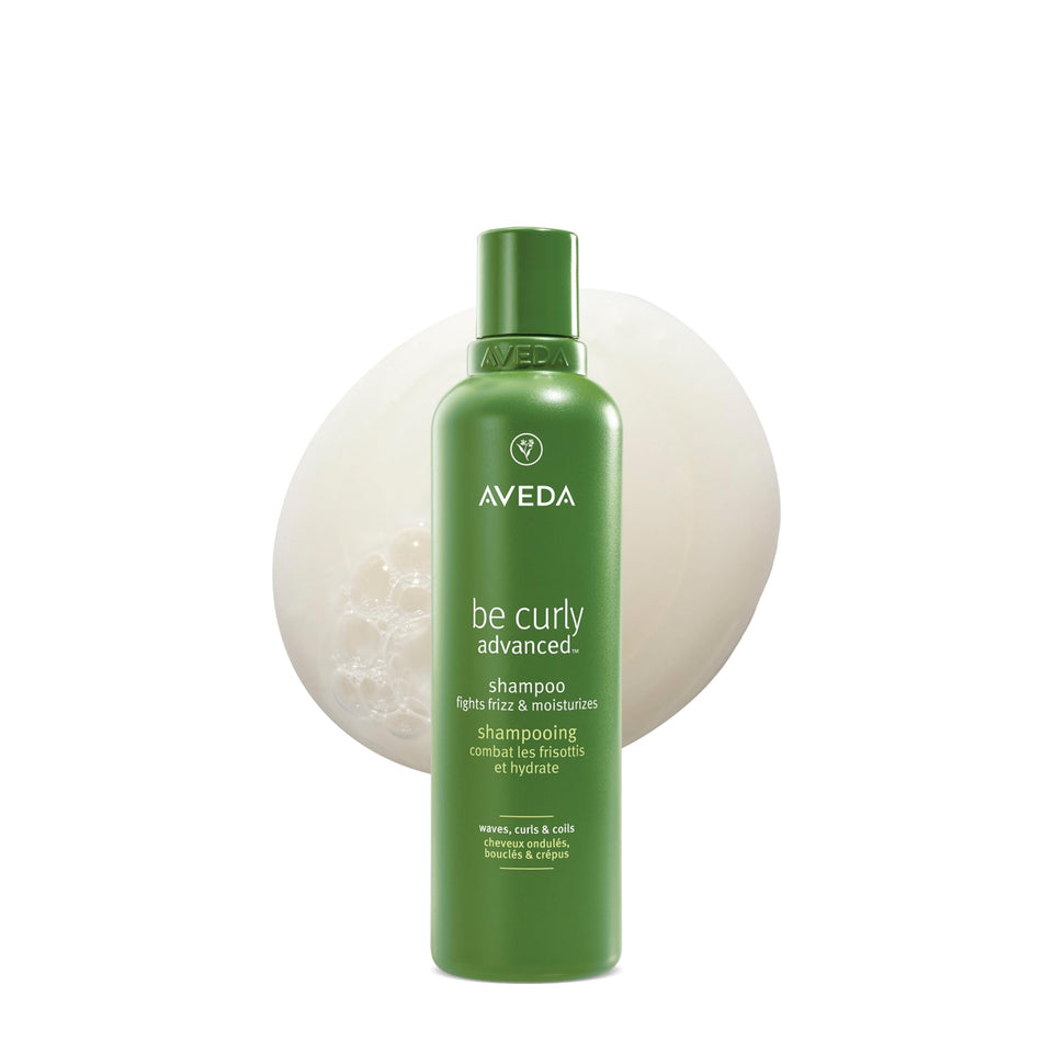 Aveda be curly bottle front showing product packaging and citrus branding benefits