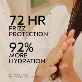 Aveda Be Curly tube cap close-up highlighting easy dispensing