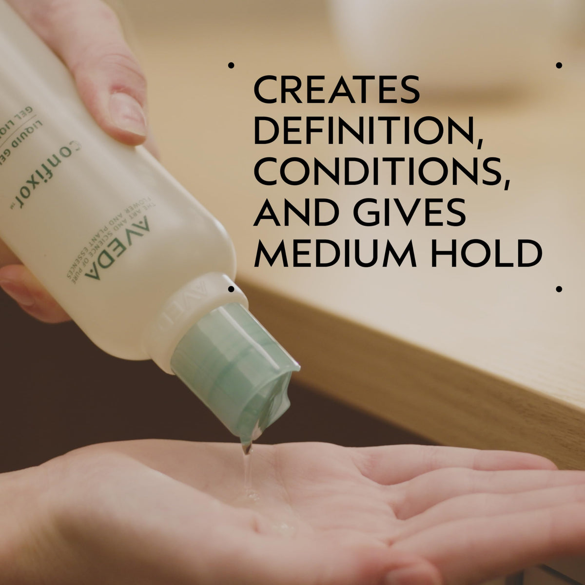 close-up of Aveda Confixor gel texture highlighting lightweight spreadability and sheen