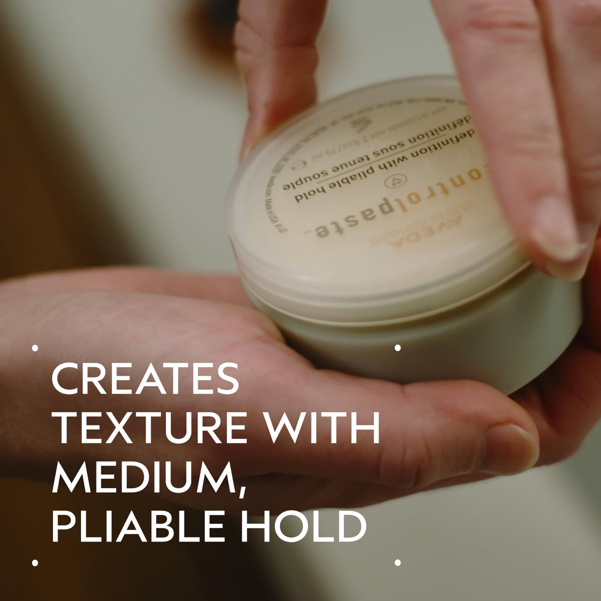 Aveda control paste open close-up showing creamy texture for easy application