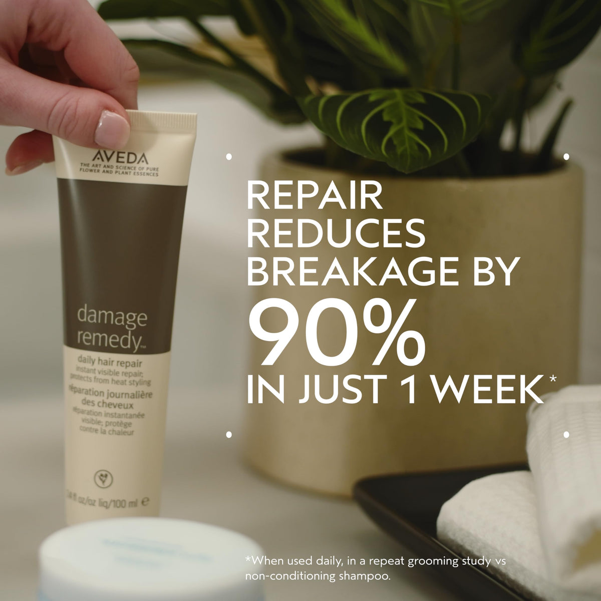 Aveda Damage Remedy creamy texture close-up highlighting smooth spreadability
