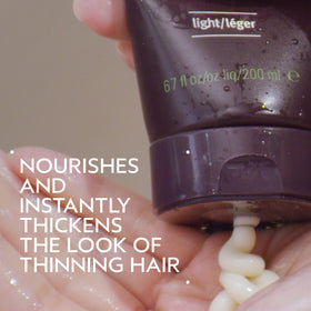 Aveda Invati Ultra Light conditioner label close-up showing ingredient and usage details