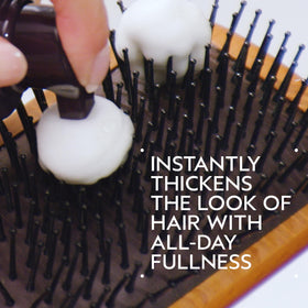 Aveda Invati Ultra foam pump in hand demonstrating easy dispensing benefit