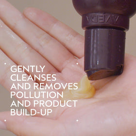 Aveda bottle pump top close-up showing dispensing ease and mess-free use