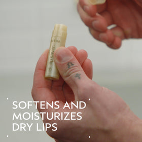 Aveda lip saver cap removed close-up revealing balm tip, precise application benefit