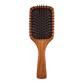 Aveda mini paddle brush front view showing compact shape and smoothing benefit