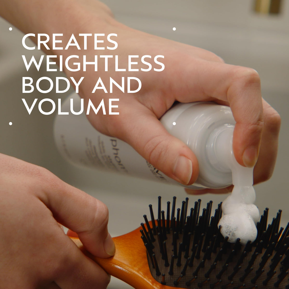 Aveda Phomollient pump detail demonstrating air-infused non-aerosol delivery