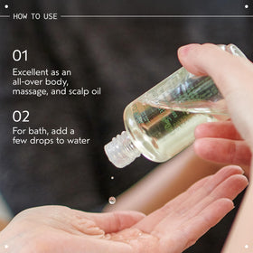 Person applying Aveda Shampure to scalp demonstrating nourishing massage benefit