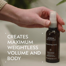 Aveda tonic spray nozzle close-up demonstrating precise root application