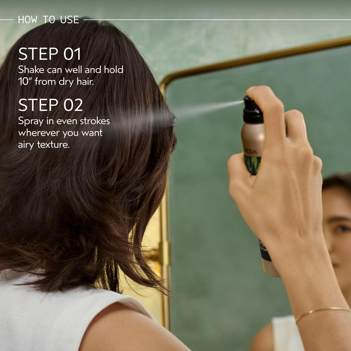 Hand holding Aveda Tousle Texture can to show size and travel-friendly scale