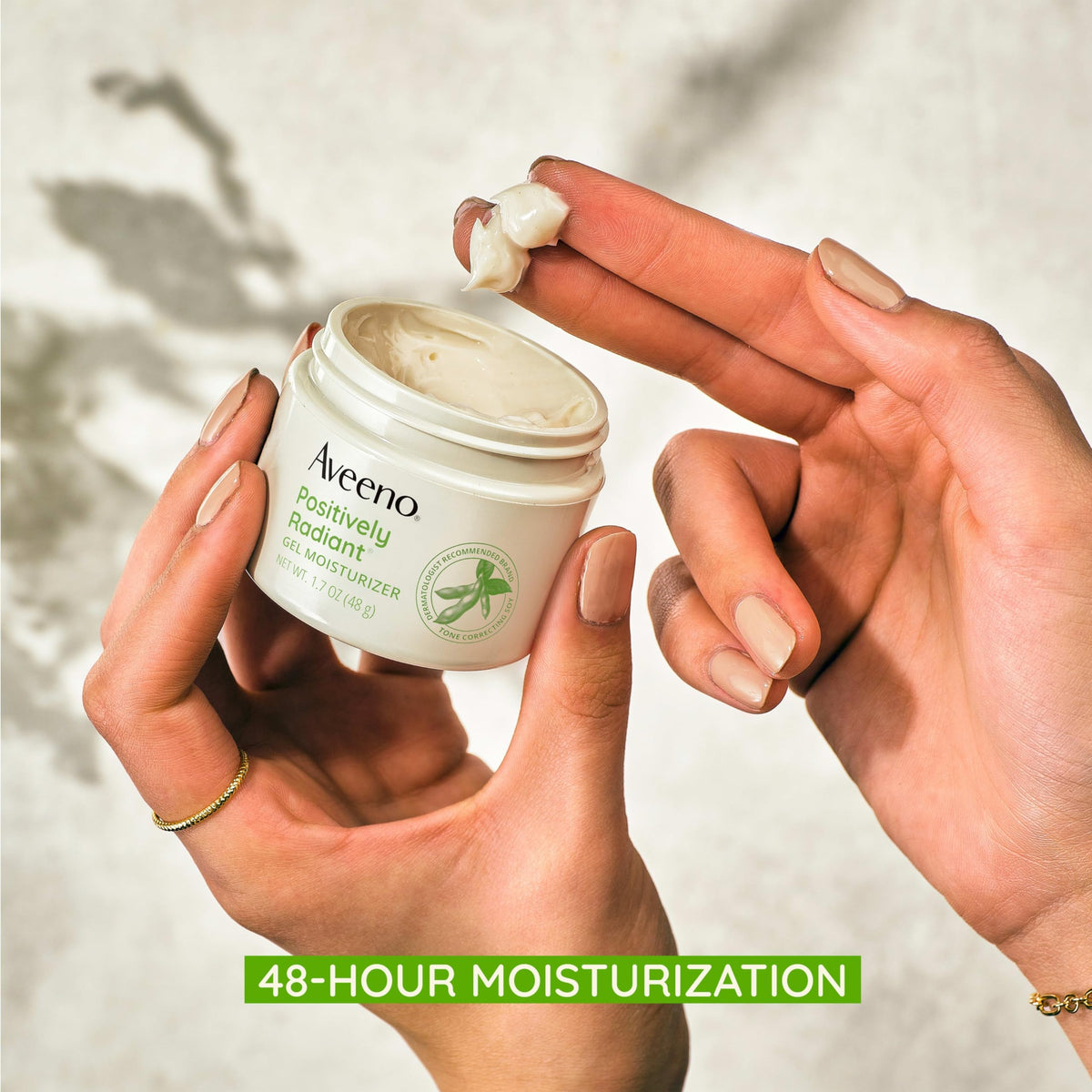 Aveeno moisturizer applied on hand demonstrating fast-absorbing hydration benefit